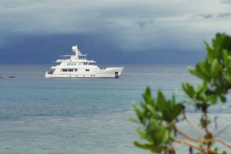 a white boat in the water aboard RELENTLESS Yacht for Sale