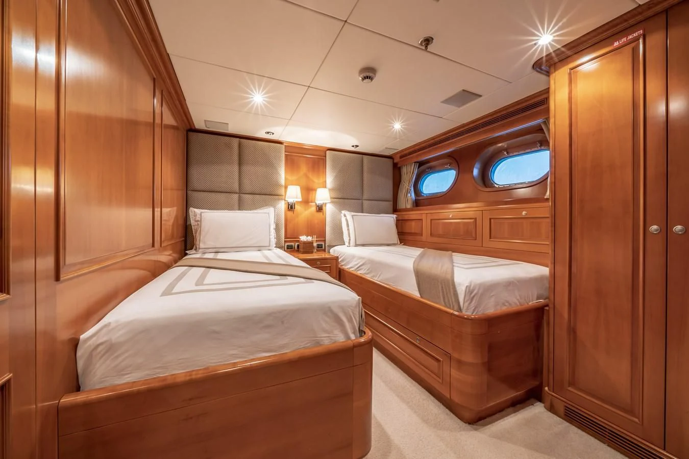 a room with two beds aboard RELENTLESS Yacht for Sale