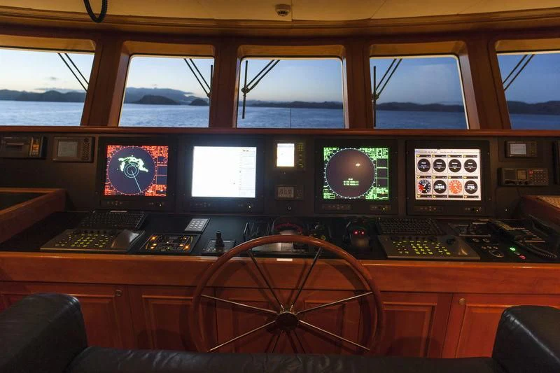 a control panel with many monitors aboard RELENTLESS Yacht for Sale