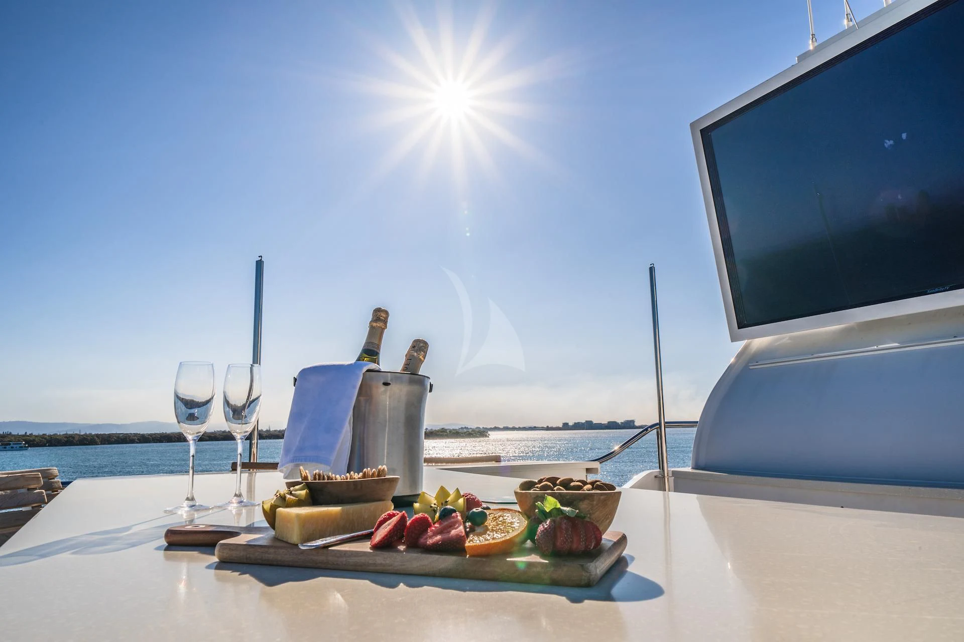 a table with food and a television aboard RELENTLESS Yacht for Sale