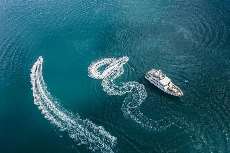 a pair of boats in the ocean aboard RELENTLESS Yacht for Sale