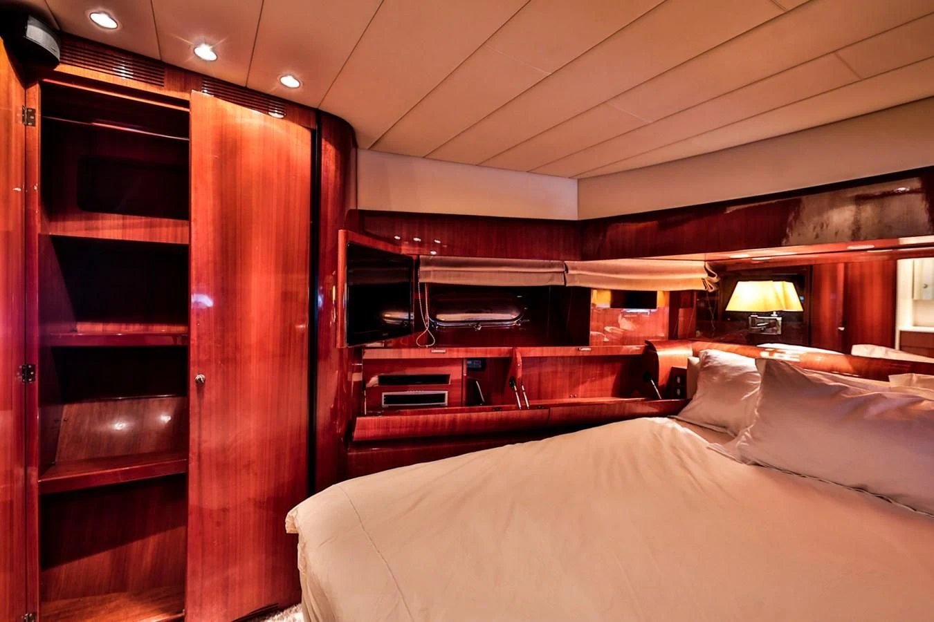 a room with a bed and a wood door aboard NOTORIOUS Yacht for Sale