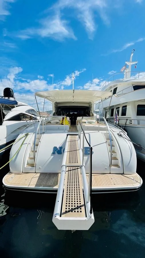a boat docked at a pier aboard NOTORIOUS Yacht for Sale
