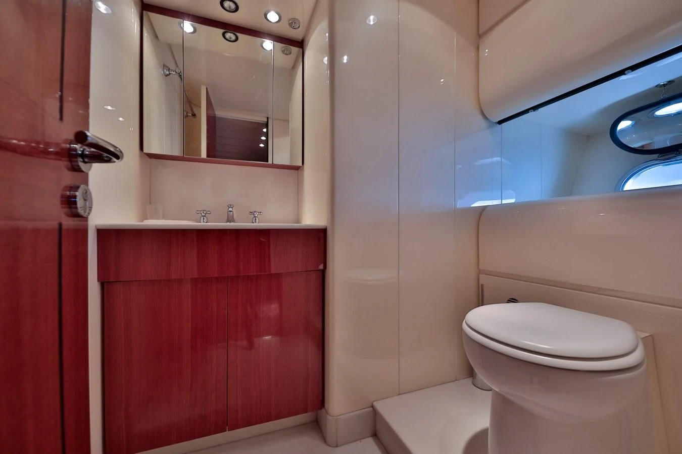a bathroom with a toilet and a sink aboard NOTORIOUS Yacht for Sale