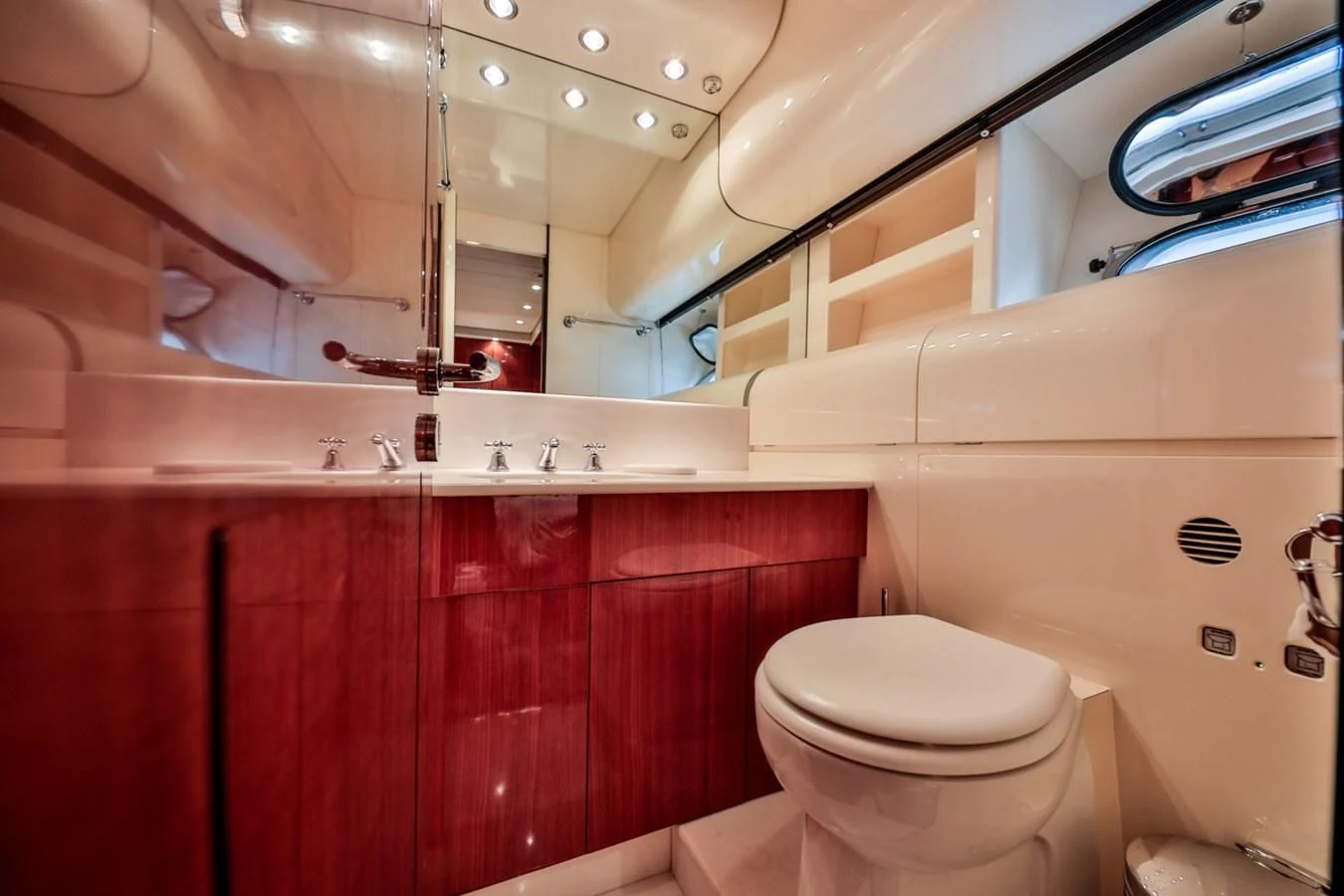 a bathroom with red cabinets aboard NOTORIOUS Yacht for Sale