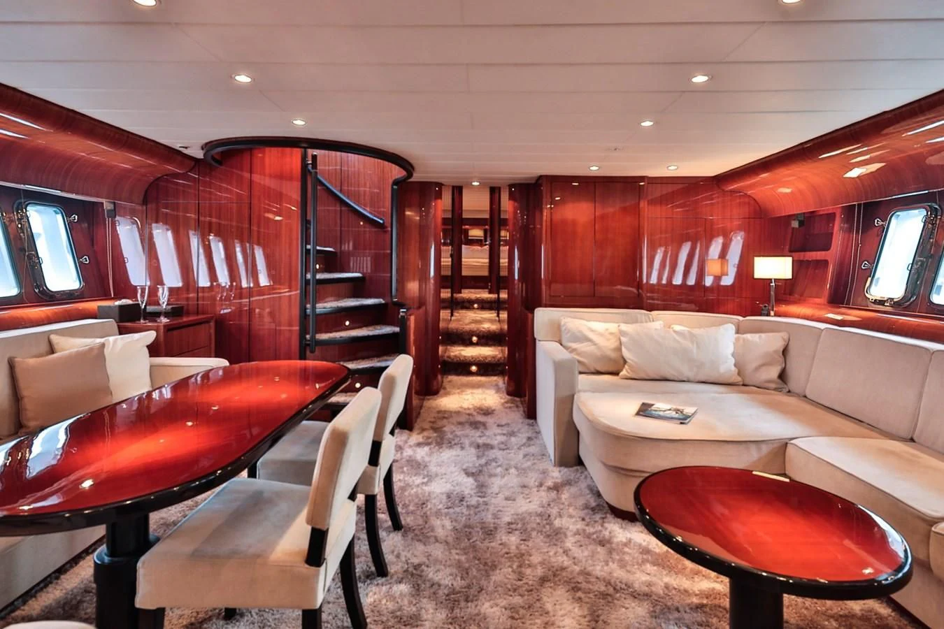 a living room with a couch and a table aboard NOTORIOUS Yacht for Sale