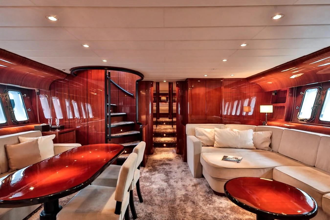 a living room with a couch and a table aboard NOTORIOUS Yacht for Sale