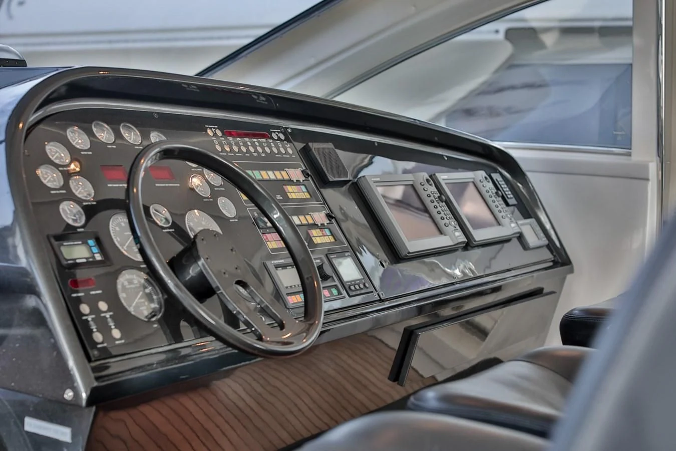a car with a couple of phones in it aboard NOTORIOUS Yacht for Sale