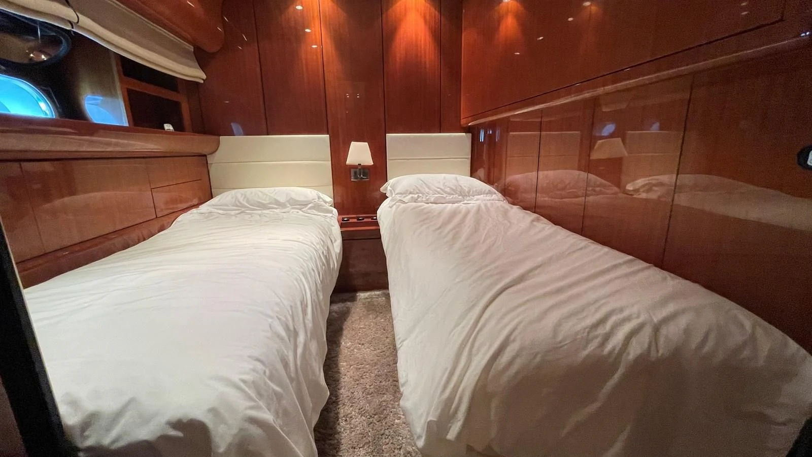 a room with two beds aboard NOTORIOUS Yacht for Sale