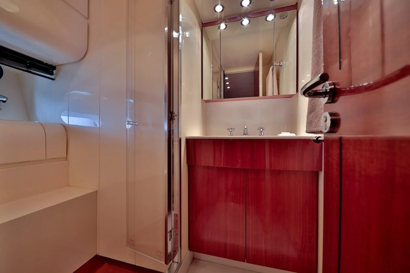 a bathroom with a mirror and a sink aboard NOTORIOUS Yacht for Sale