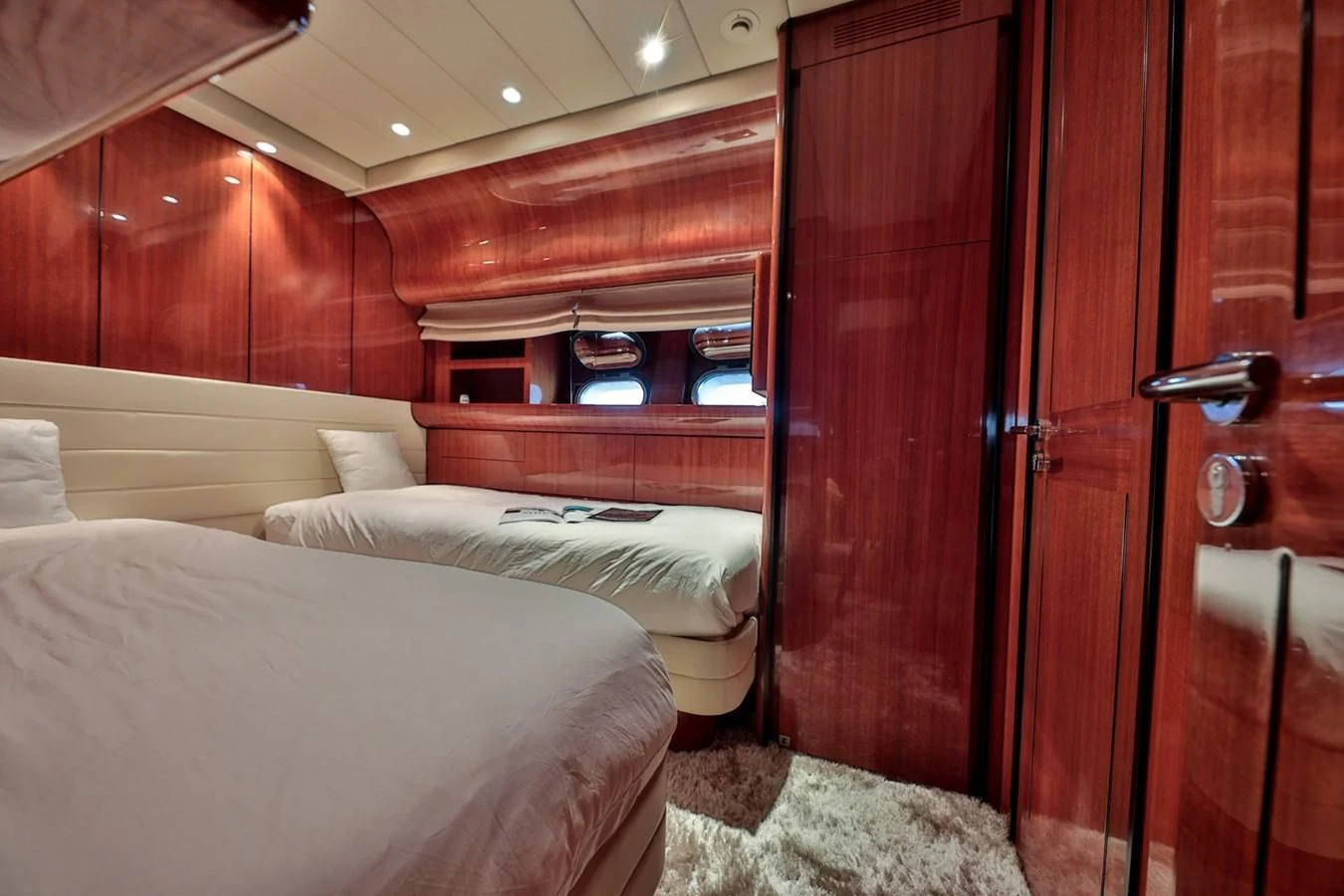 a room with two beds aboard NOTORIOUS Yacht for Sale