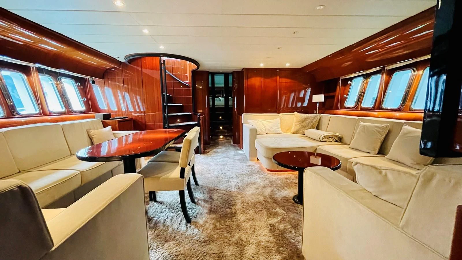 a room with a couch and a table aboard NOTORIOUS Yacht for Sale