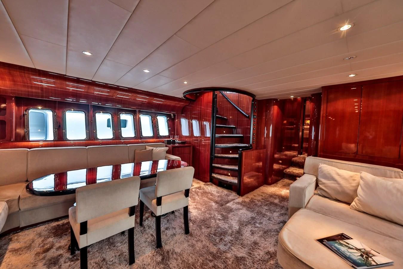 a living room with a staircase aboard NOTORIOUS Yacht for Sale
