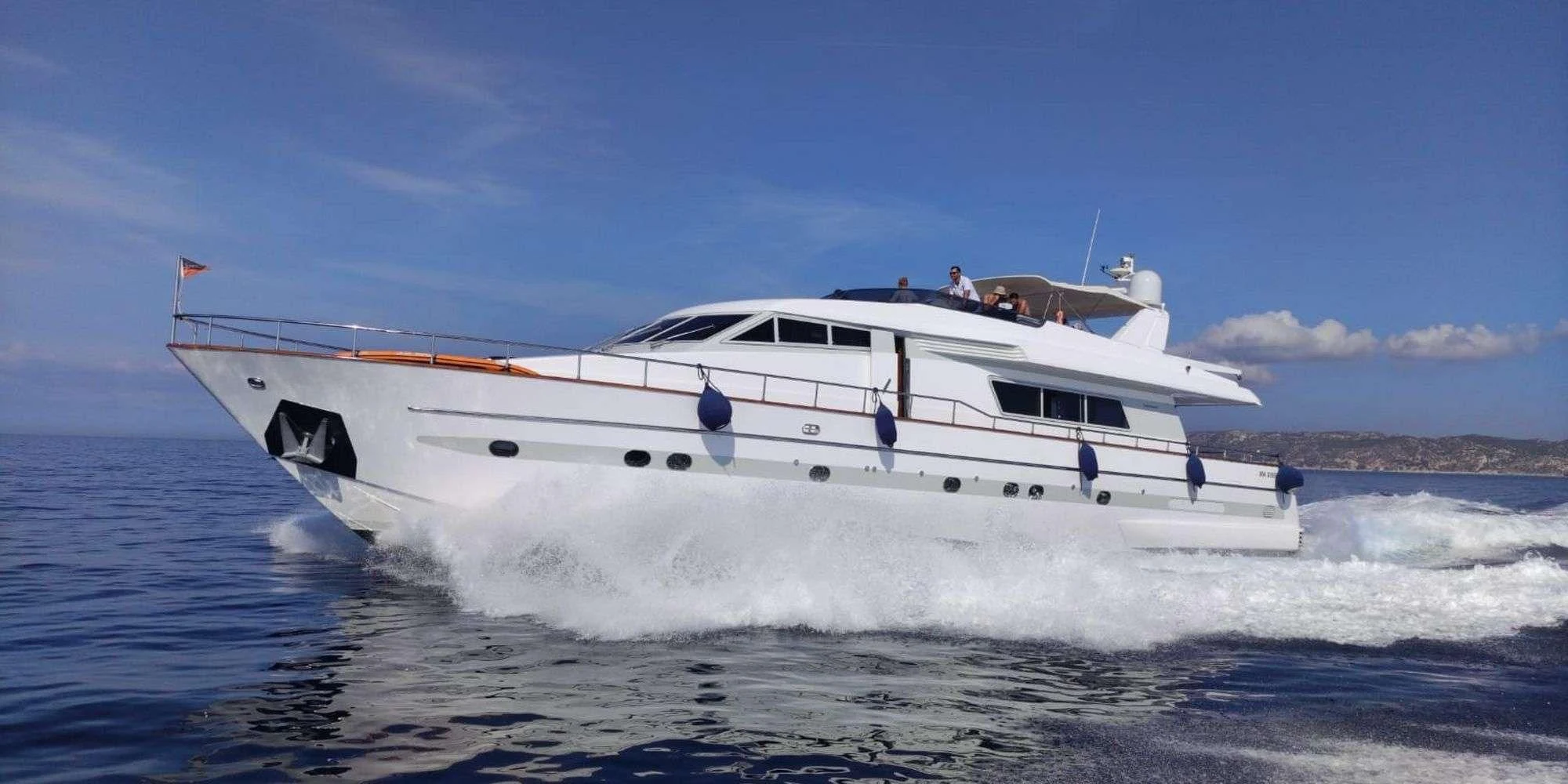 a white yacht with people on it aboard OLA Yacht for Charter