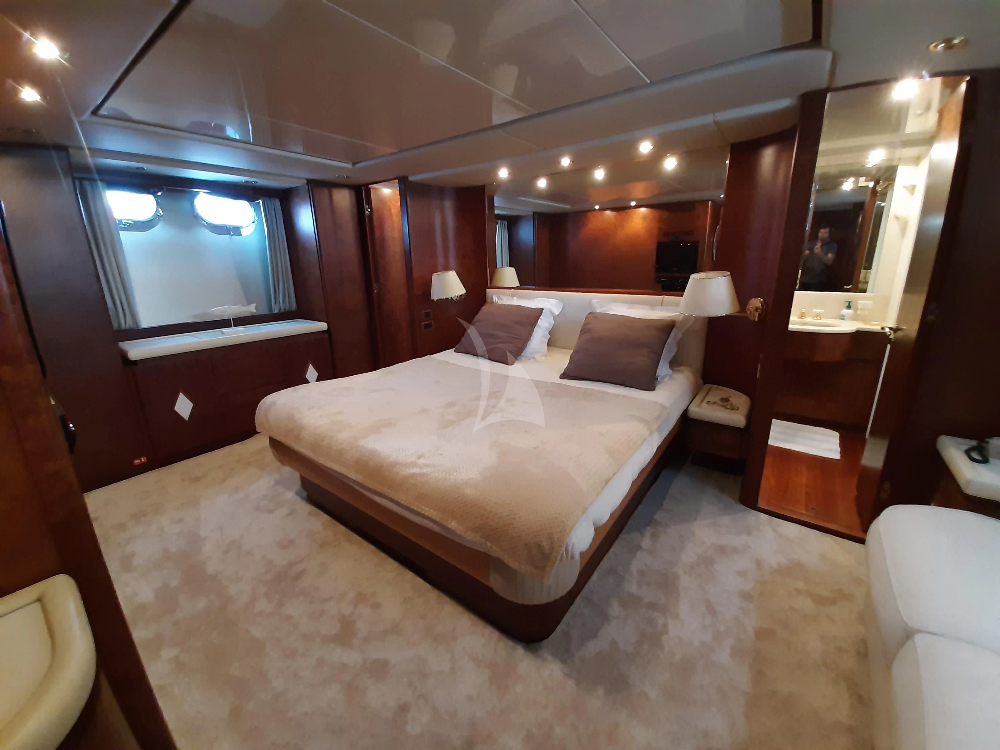 a hotel room with a bed aboard OLA Yacht for Charter