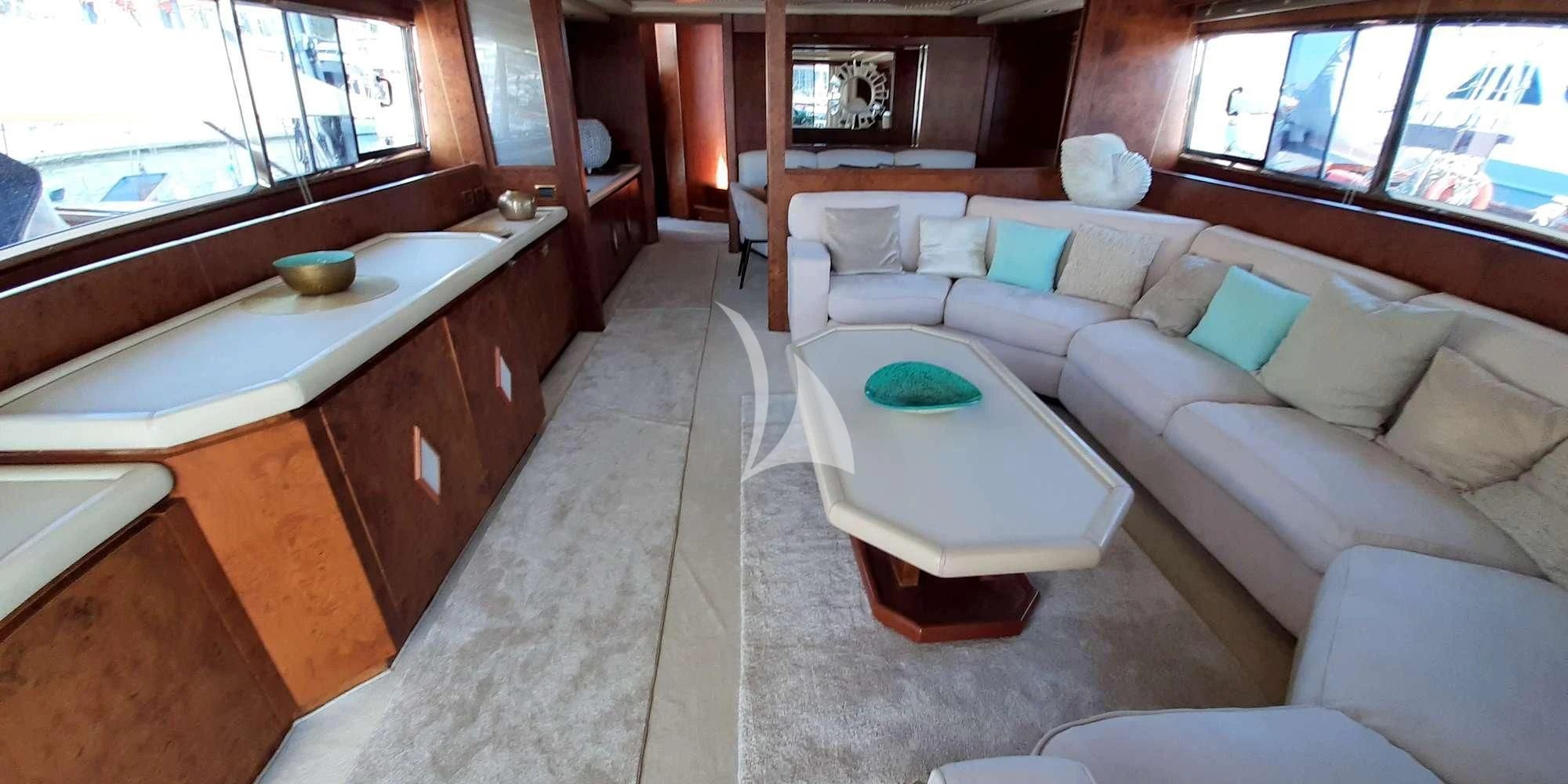 a living room with a couch and a table aboard OLA Yacht for Charter