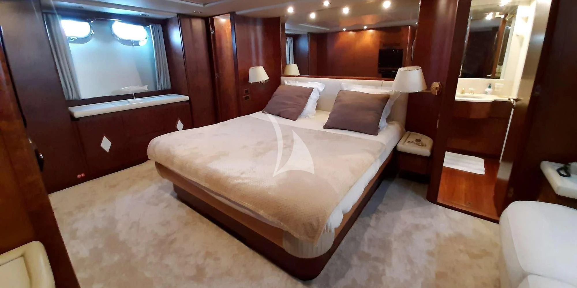 a large bed in a room aboard OLA Yacht for Charter