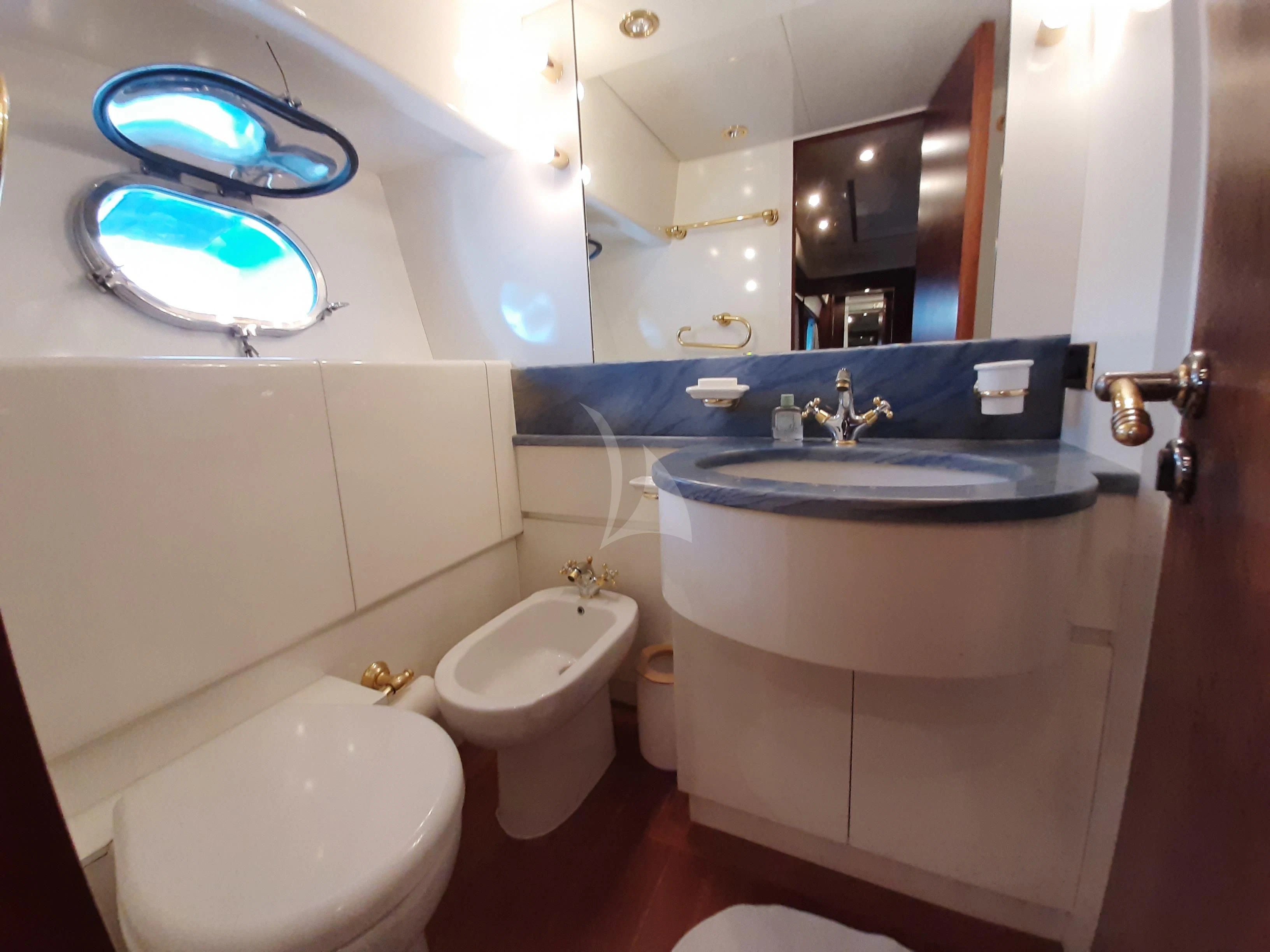 a bathroom with a sink and a toilet aboard OLA Yacht for Charter