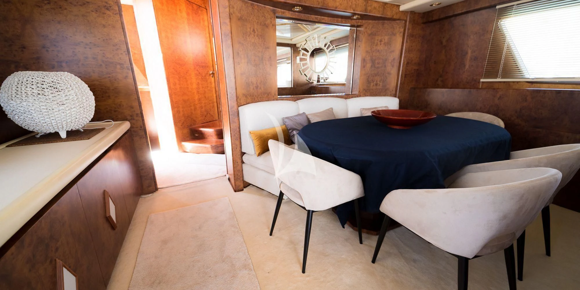 a room with a table and chairs aboard OLA Yacht for Charter