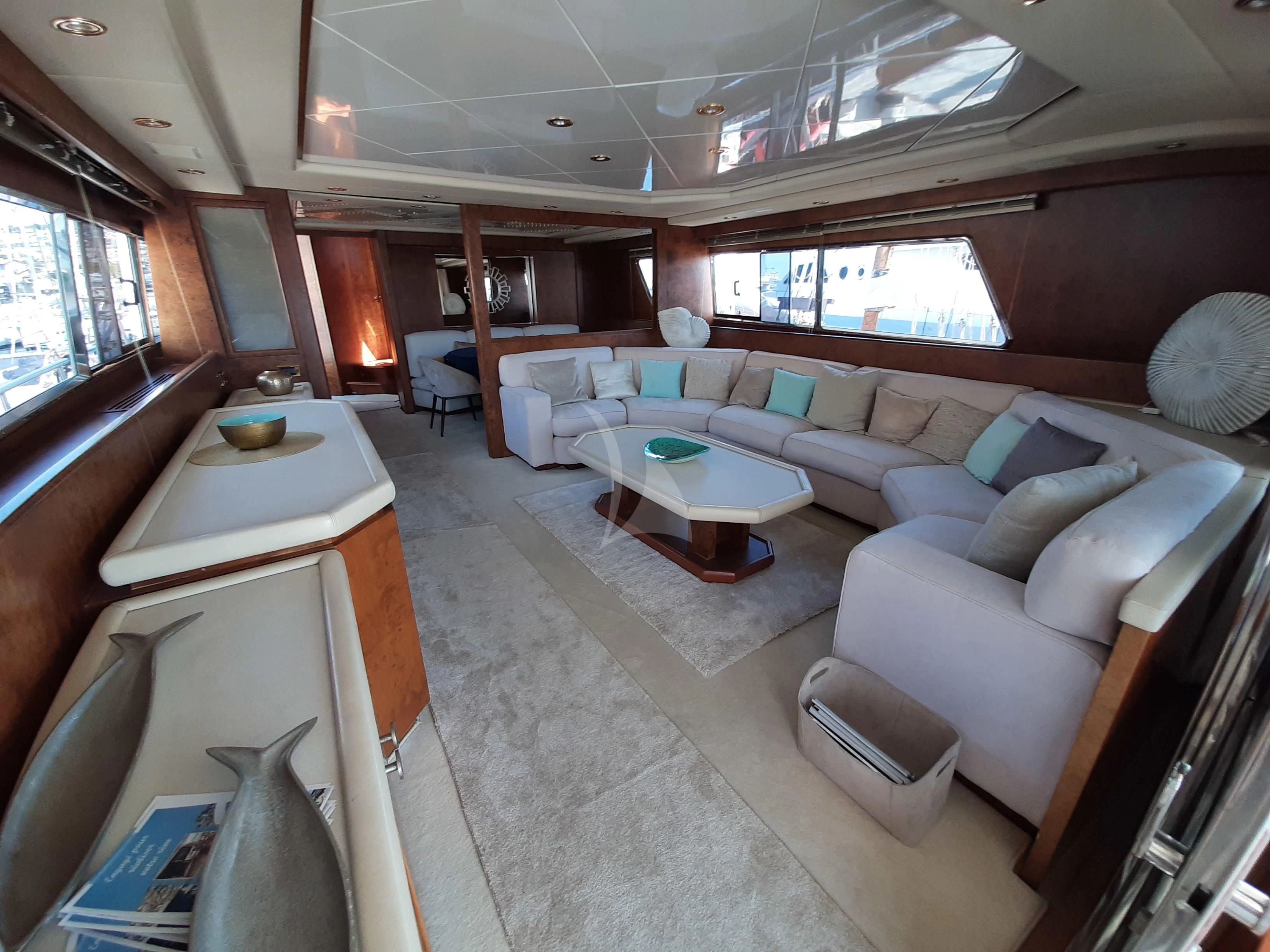 a room with a couch and a table aboard OLA Yacht for Charter