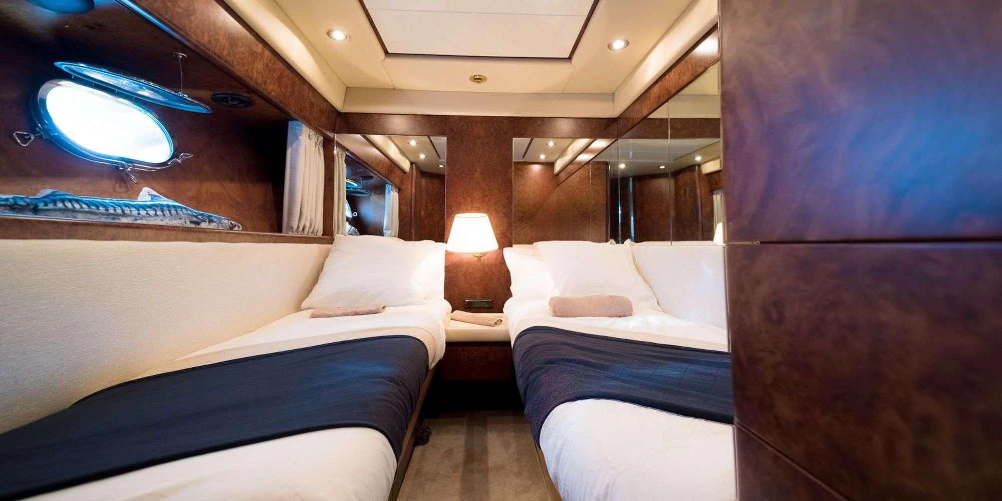 a room with two beds aboard OLA Yacht for Charter