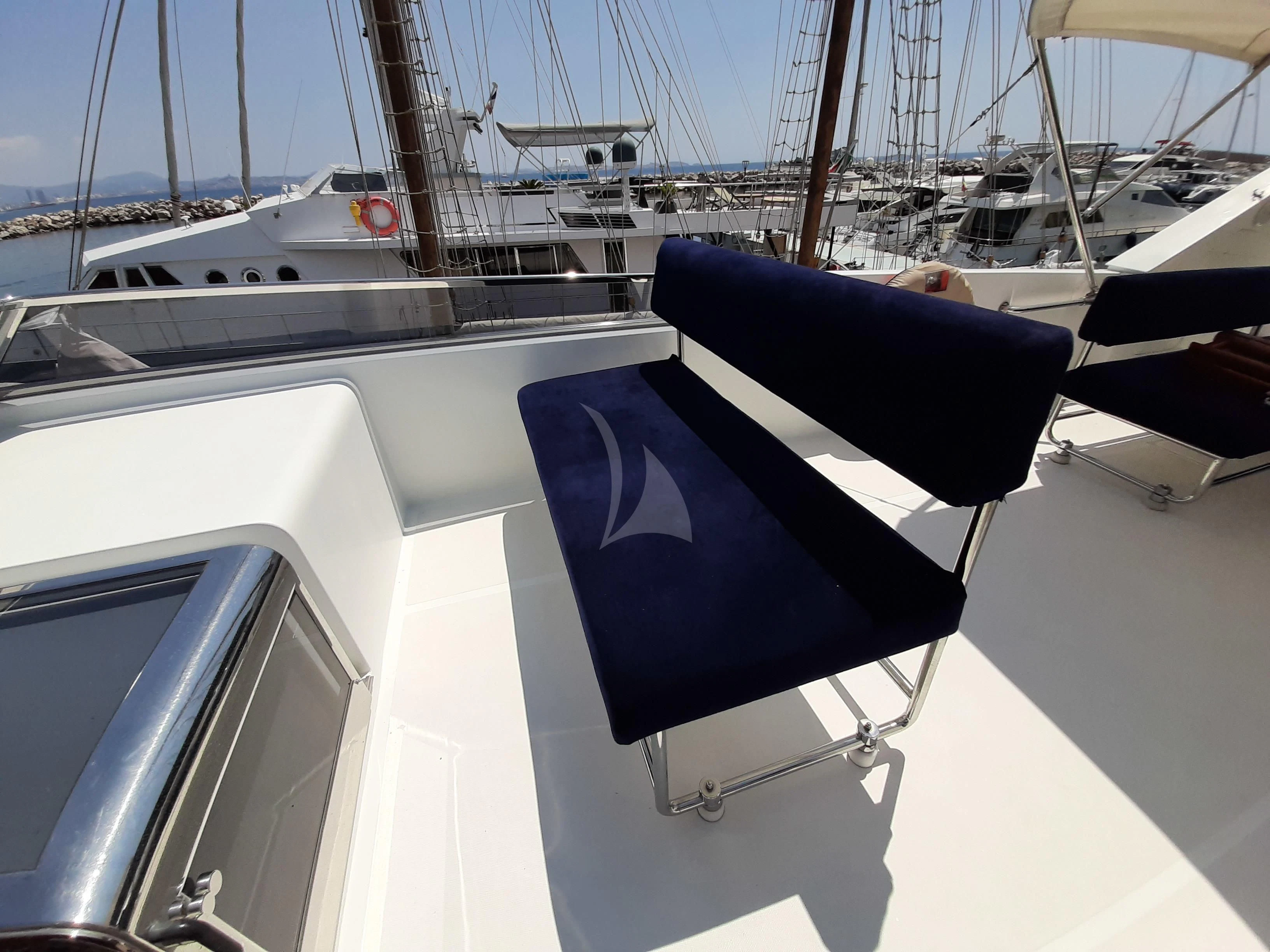 a blue and white boat aboard OLA Yacht for Charter