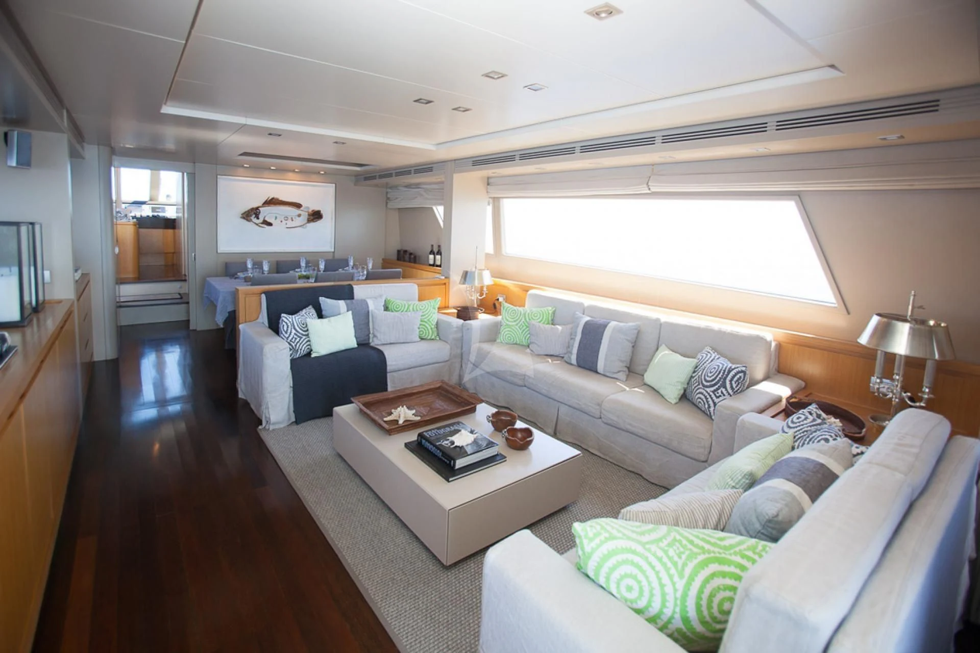 a living room with a couch and a coffee table aboard GOTA Yacht for Sale