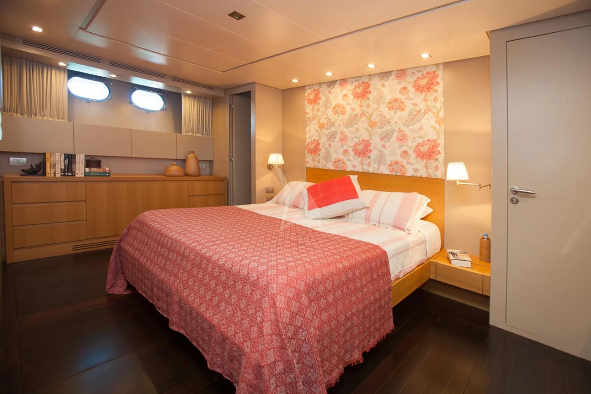 a bedroom with a bed and desk aboard GOTA Yacht for Sale
