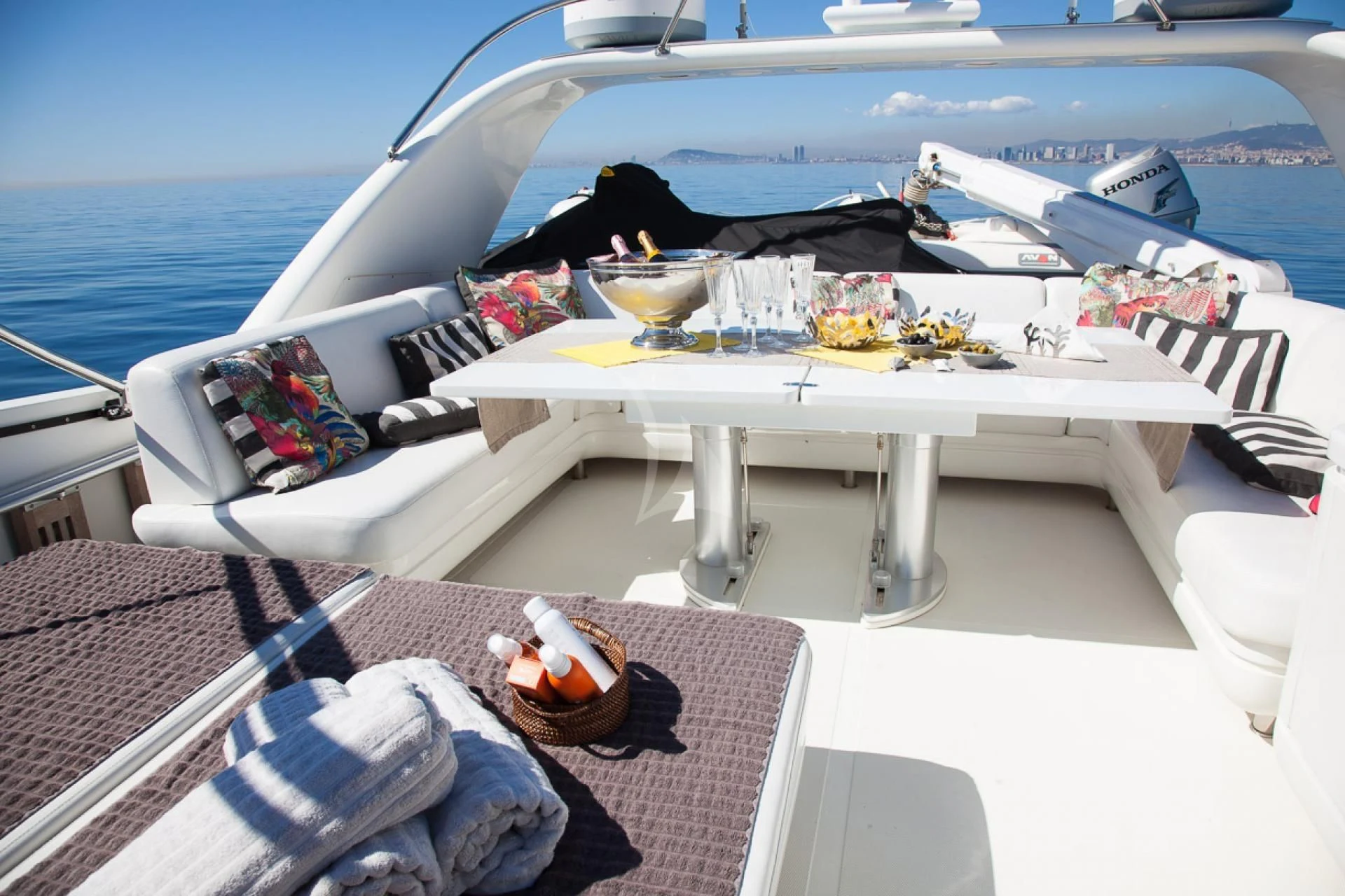 a boat with a table and drinks on it aboard GOTA Yacht for Sale
