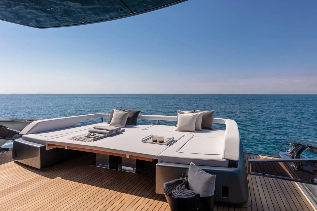 a large white bed on a boat aboard RIVA FOLGORE 88/24 Yacht for Sale