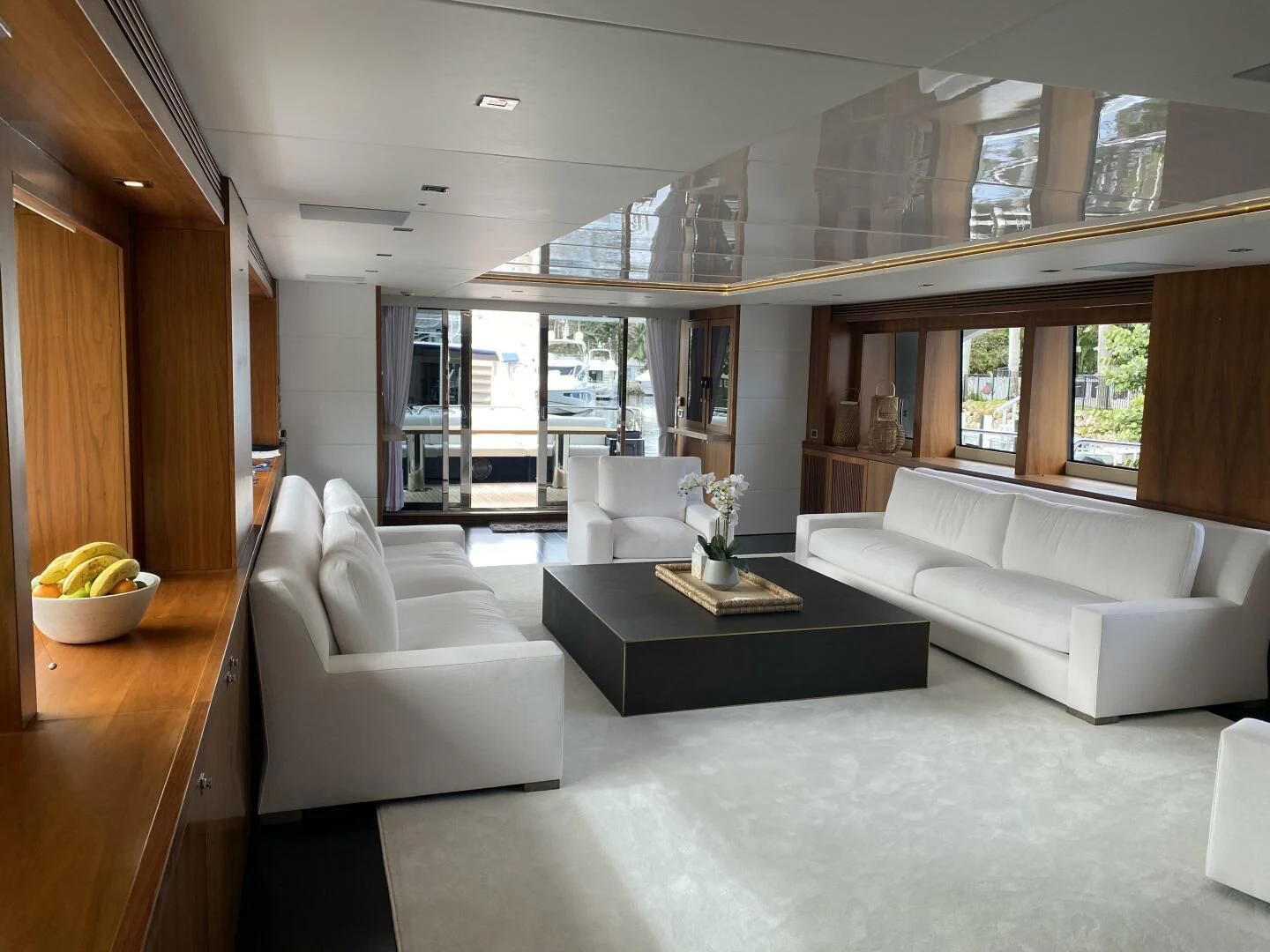 a living room with white couches aboard SEAHORSE Yacht for Sale