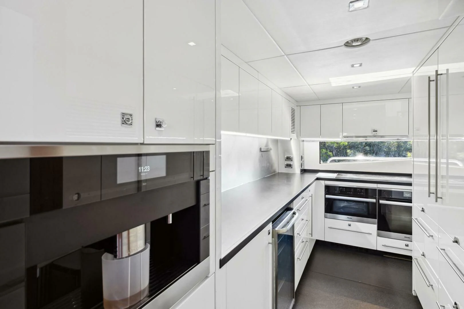 a kitchen with white cabinets aboard SEAHORSE Yacht for Sale