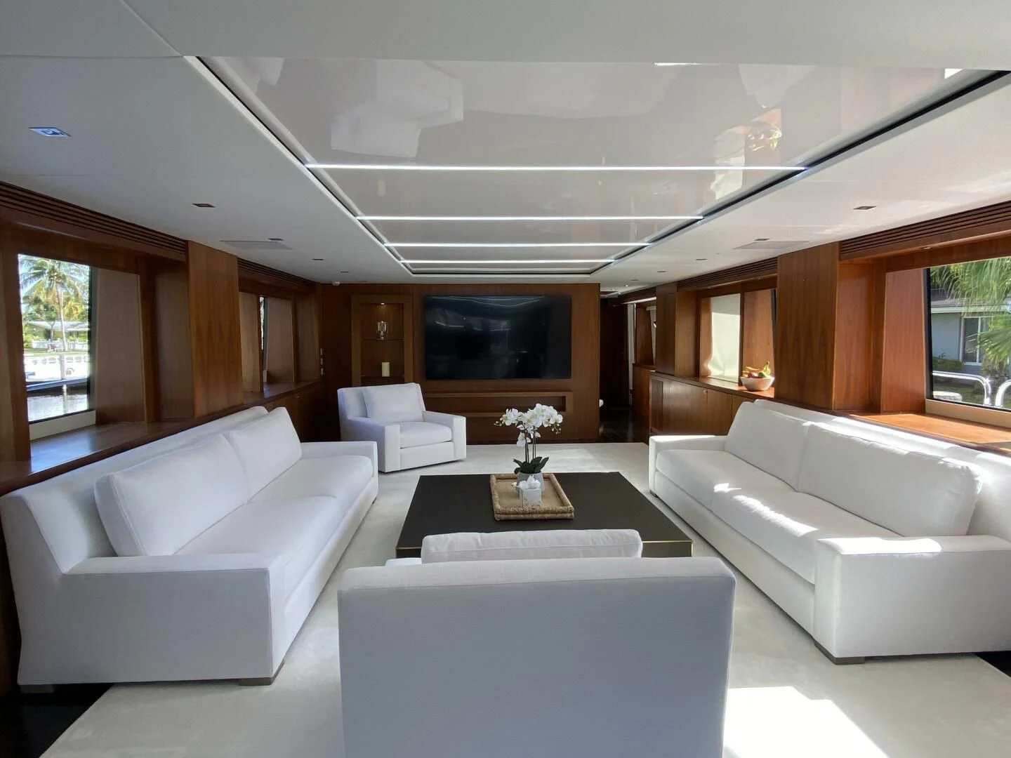 a living room with white couches aboard SEAHORSE Yacht for Sale