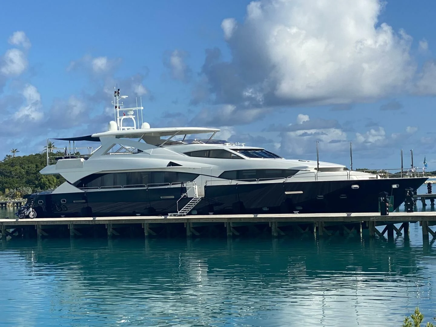 a large yacht docked at a dock aboard SEAHORSE Yacht for Sale