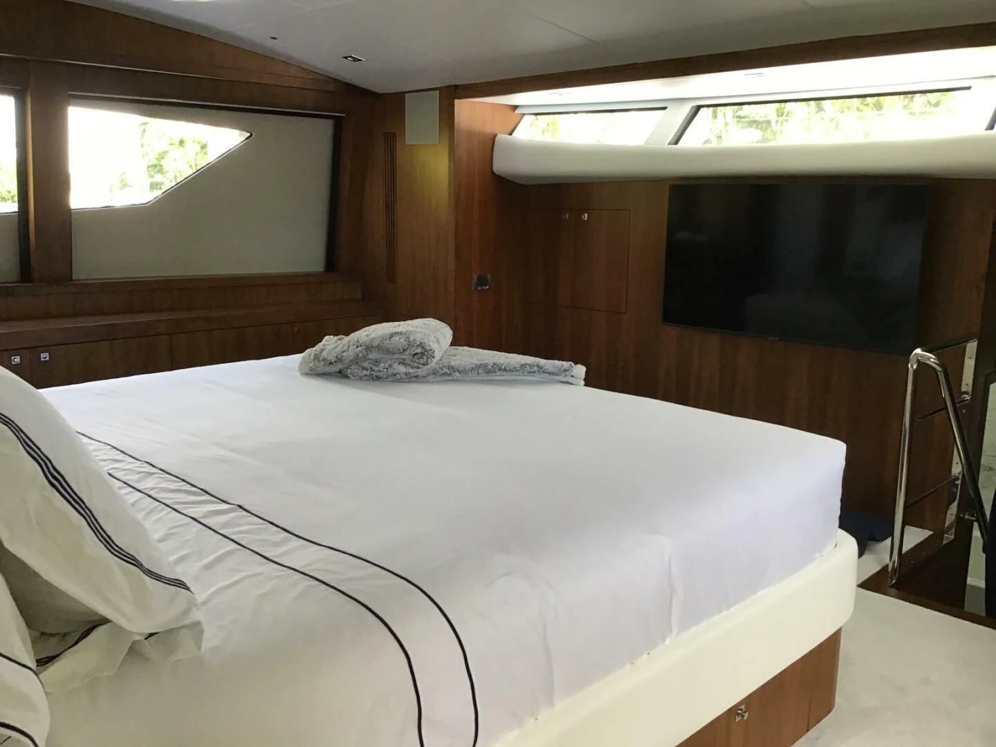 a bed with a white sheet aboard SEAHORSE Yacht for Sale