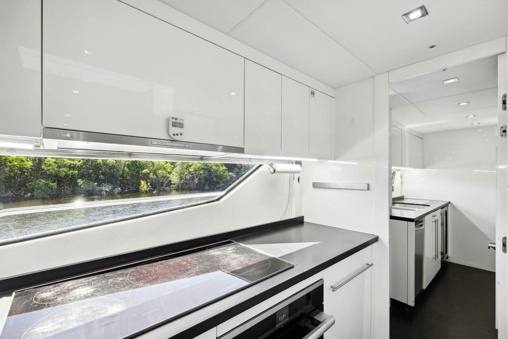a kitchen with white cabinets aboard SEAHORSE Yacht for Sale