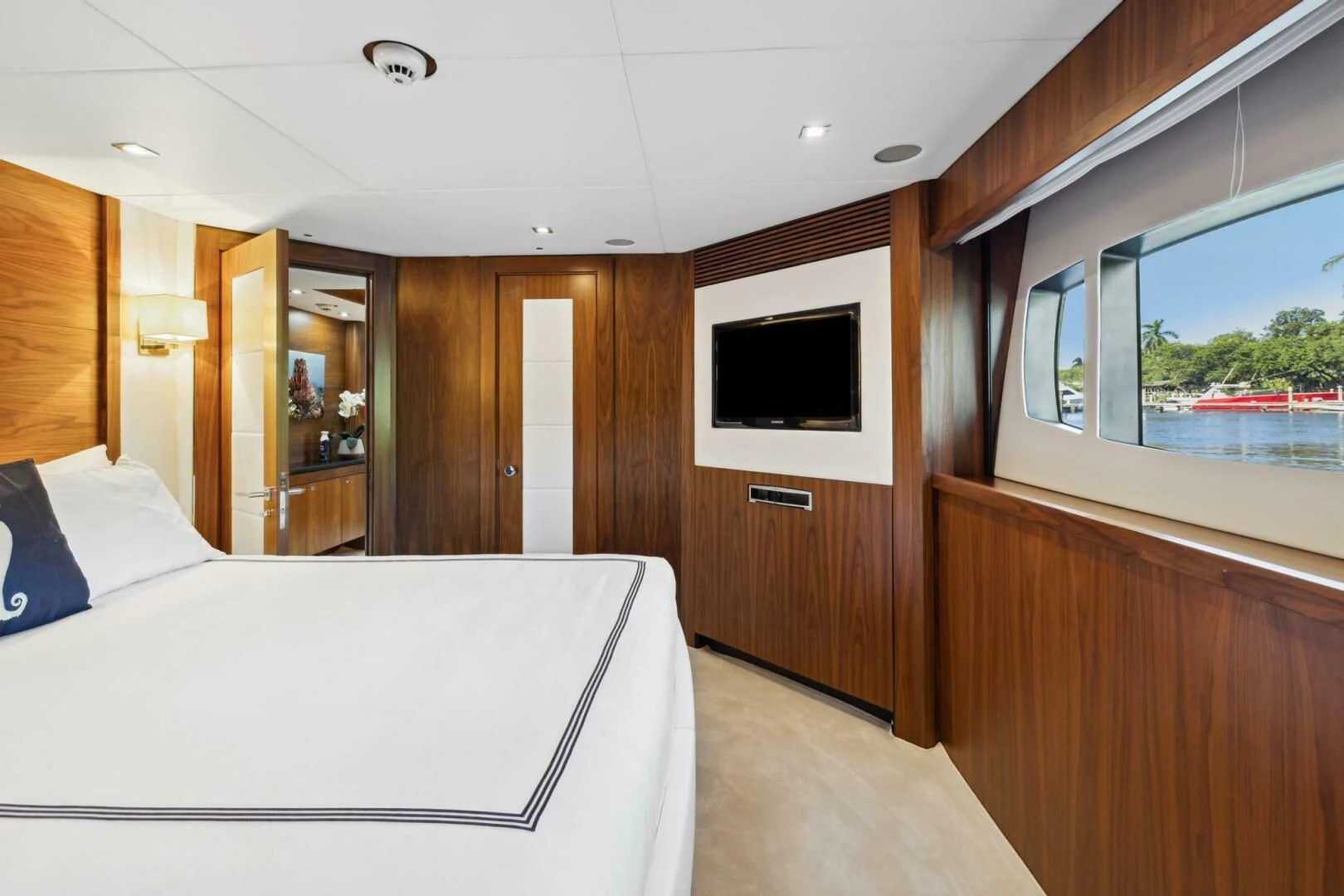 a room with a bed and a television aboard SEAHORSE Yacht for Sale