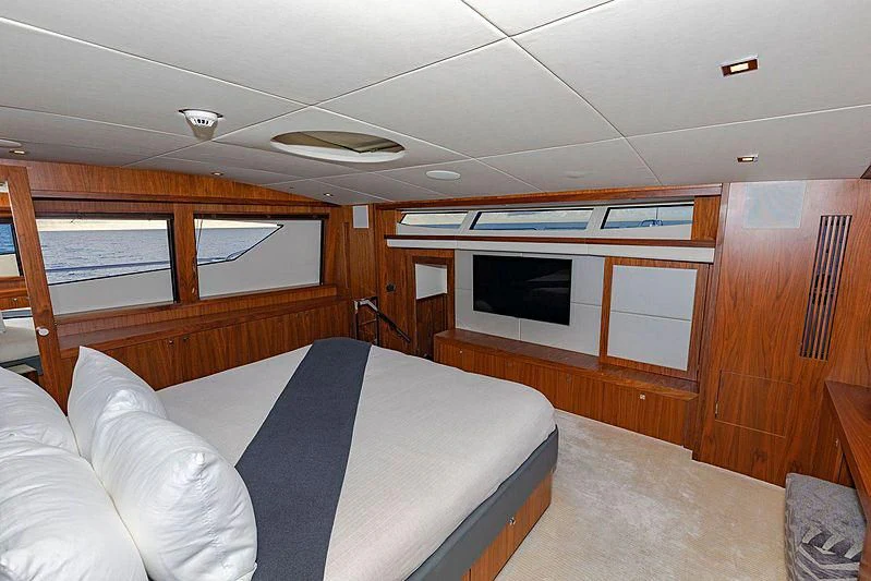 a room with a bed and a television aboard SEAHORSE Yacht for Sale