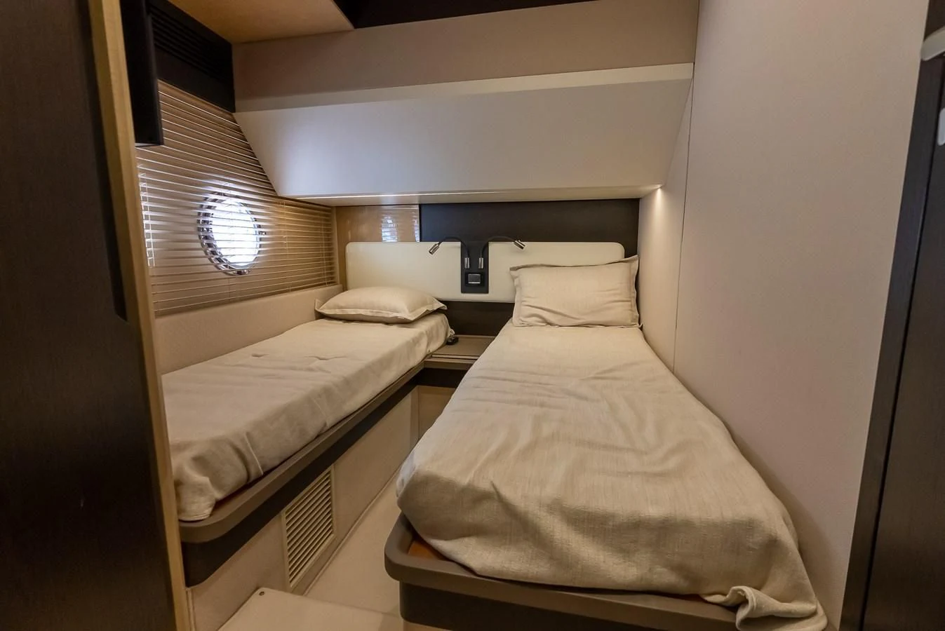 a couple of beds in a room aboard PRIVE Yacht for Sale