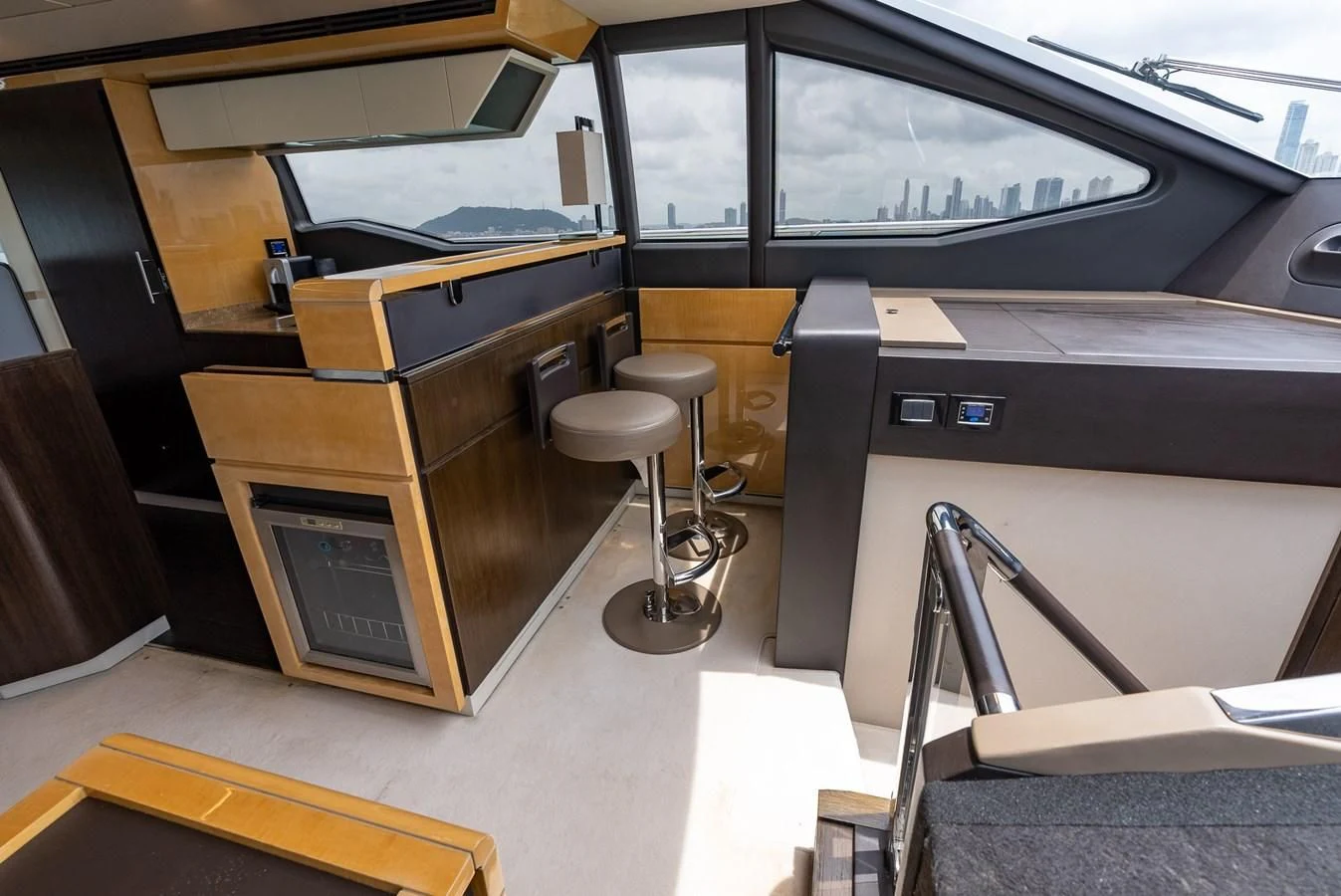 a room with a desk and a chair aboard PRIVE Yacht for Sale