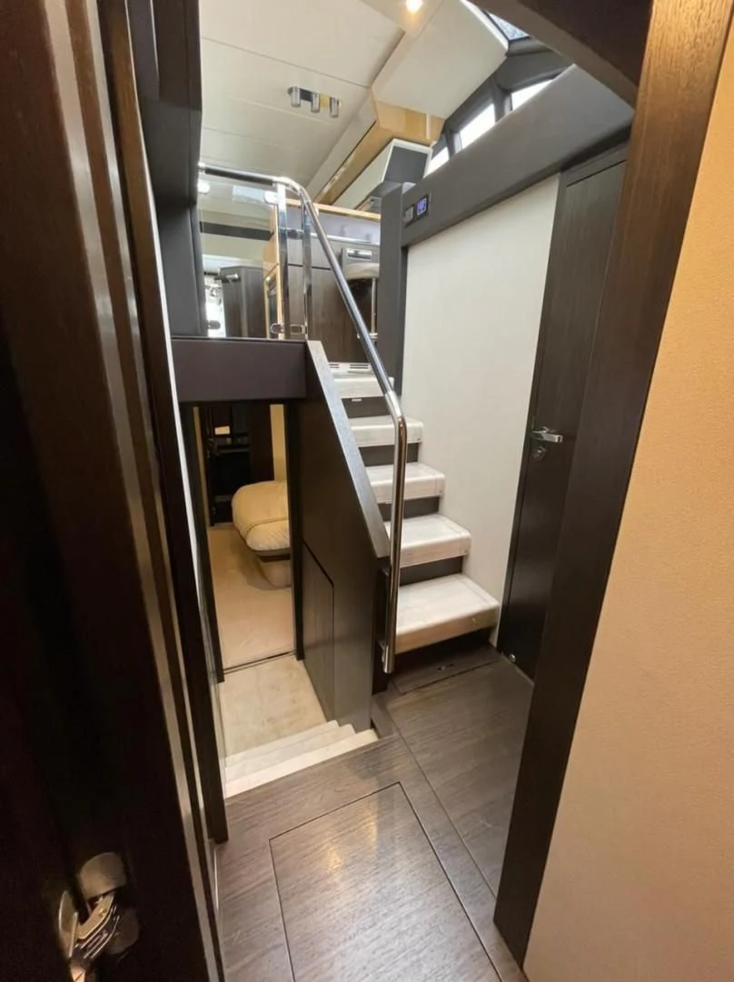 a bathroom with a toilet and a sink aboard PRIVE Yacht for Sale
