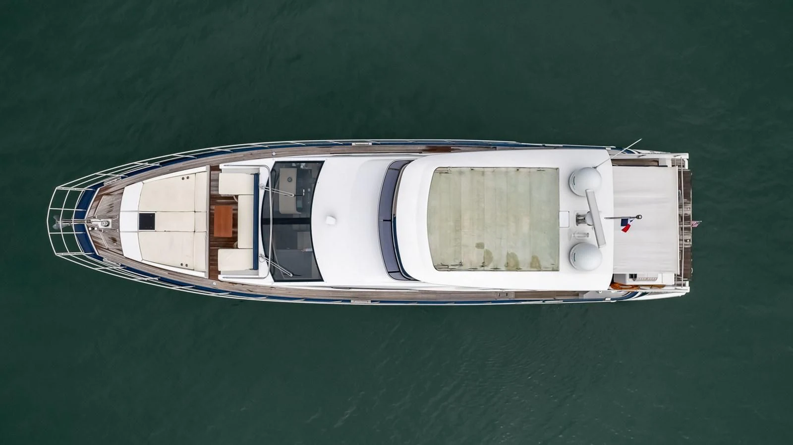 a small boat on the water aboard PRIVE Yacht for Sale
