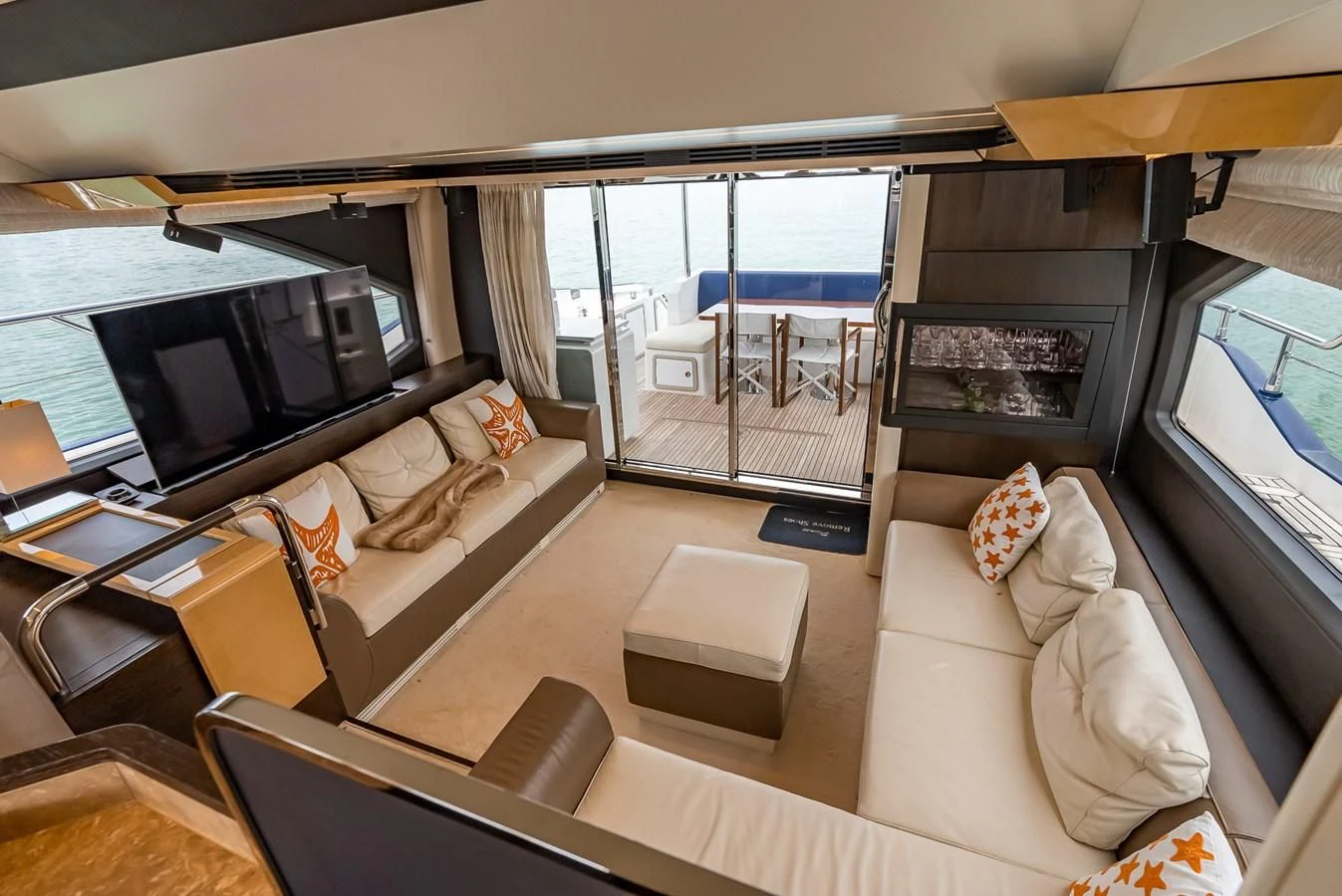 a living room with a large window aboard PRIVE Yacht for Sale