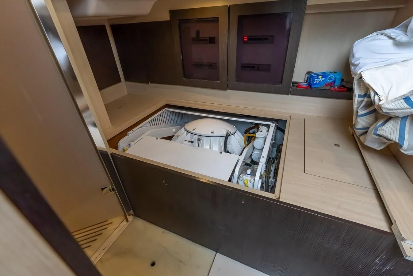 a small table with a shelf aboard PRIVE Yacht for Sale