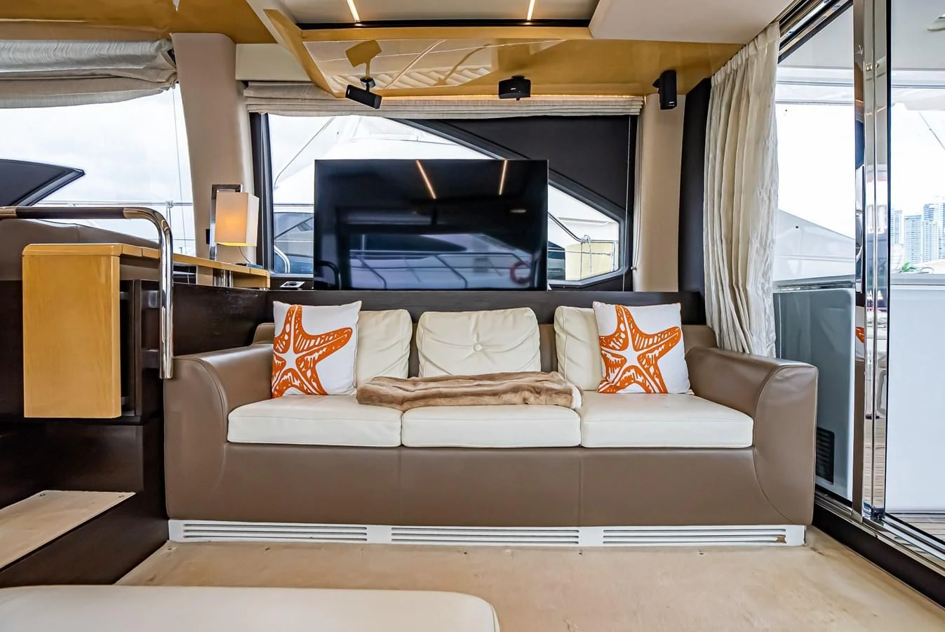 a couch in a room aboard PRIVE Yacht for Sale
