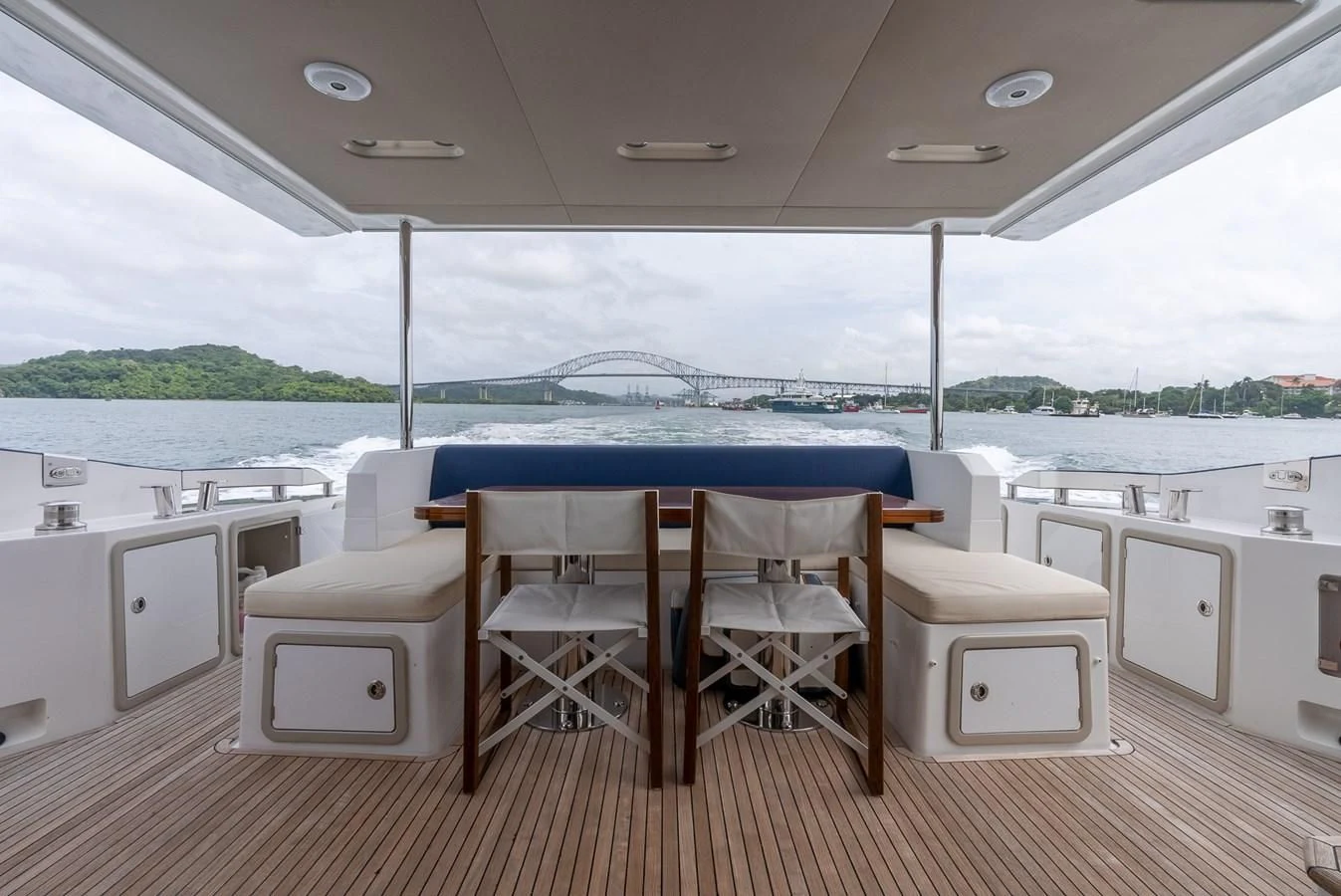 a table and chairs on a deck aboard PRIVE Yacht for Sale