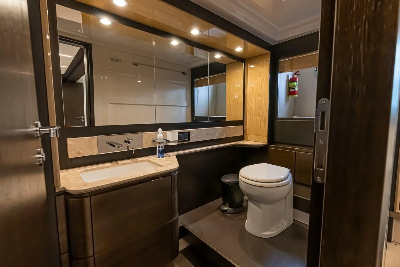 a bathroom with a large mirror aboard PRIVE Yacht for Sale