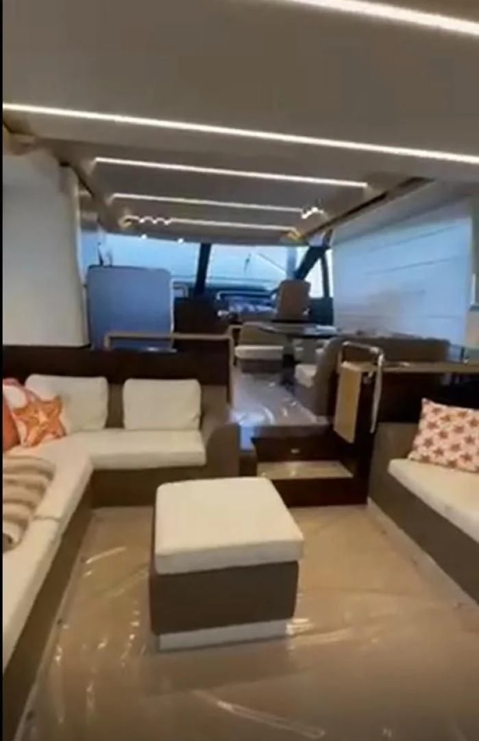 a room with a couch and a table aboard PRIVE Yacht for Sale