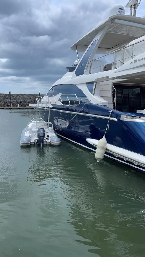 a boat docked at a pier aboard PRIVE Yacht for Sale