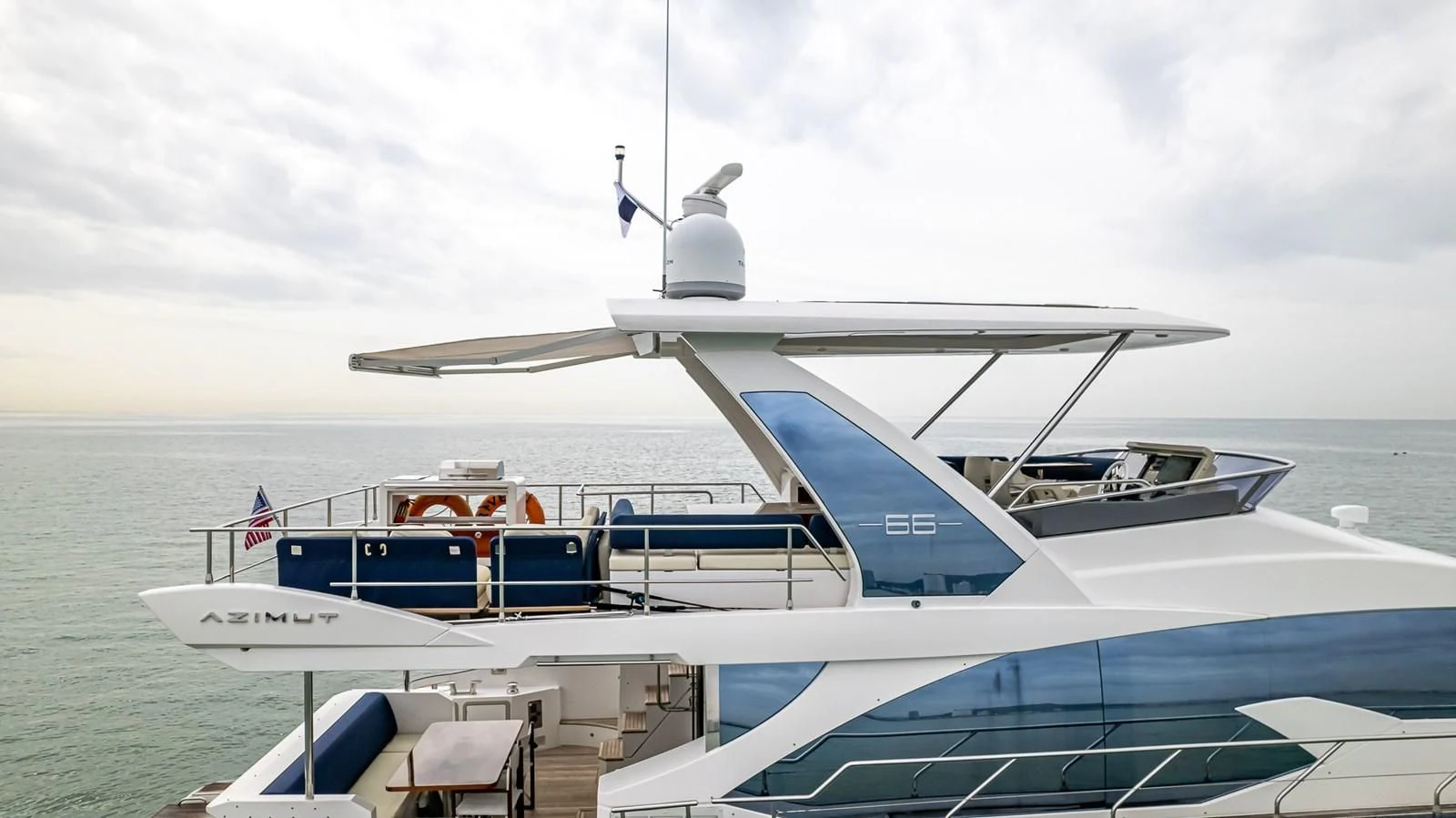 a boat with a white canopy aboard PRIVE Yacht for Sale